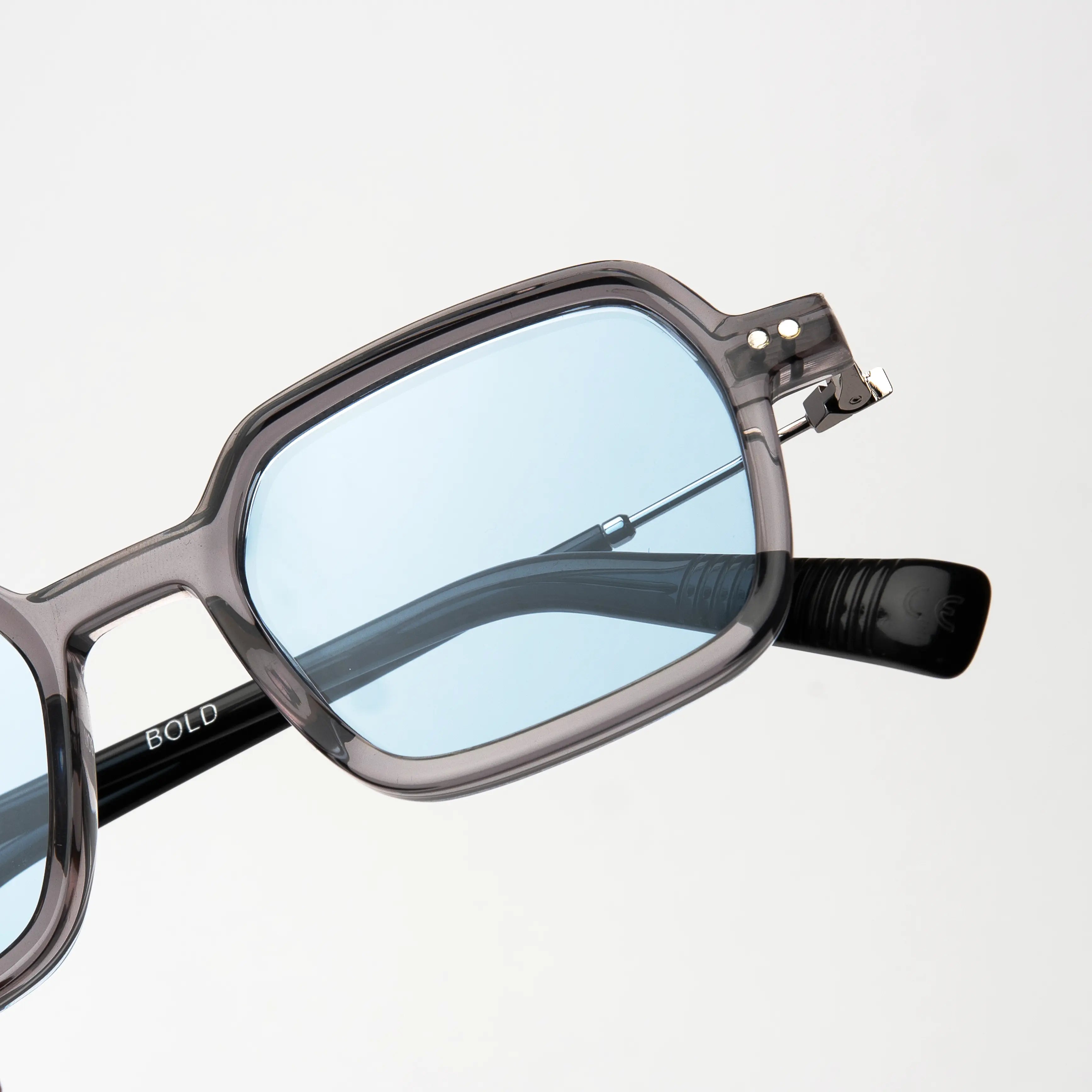 Bold Silver Sunglasses featuring a modern design with bold angles and soft curves, perfect for making a statement.