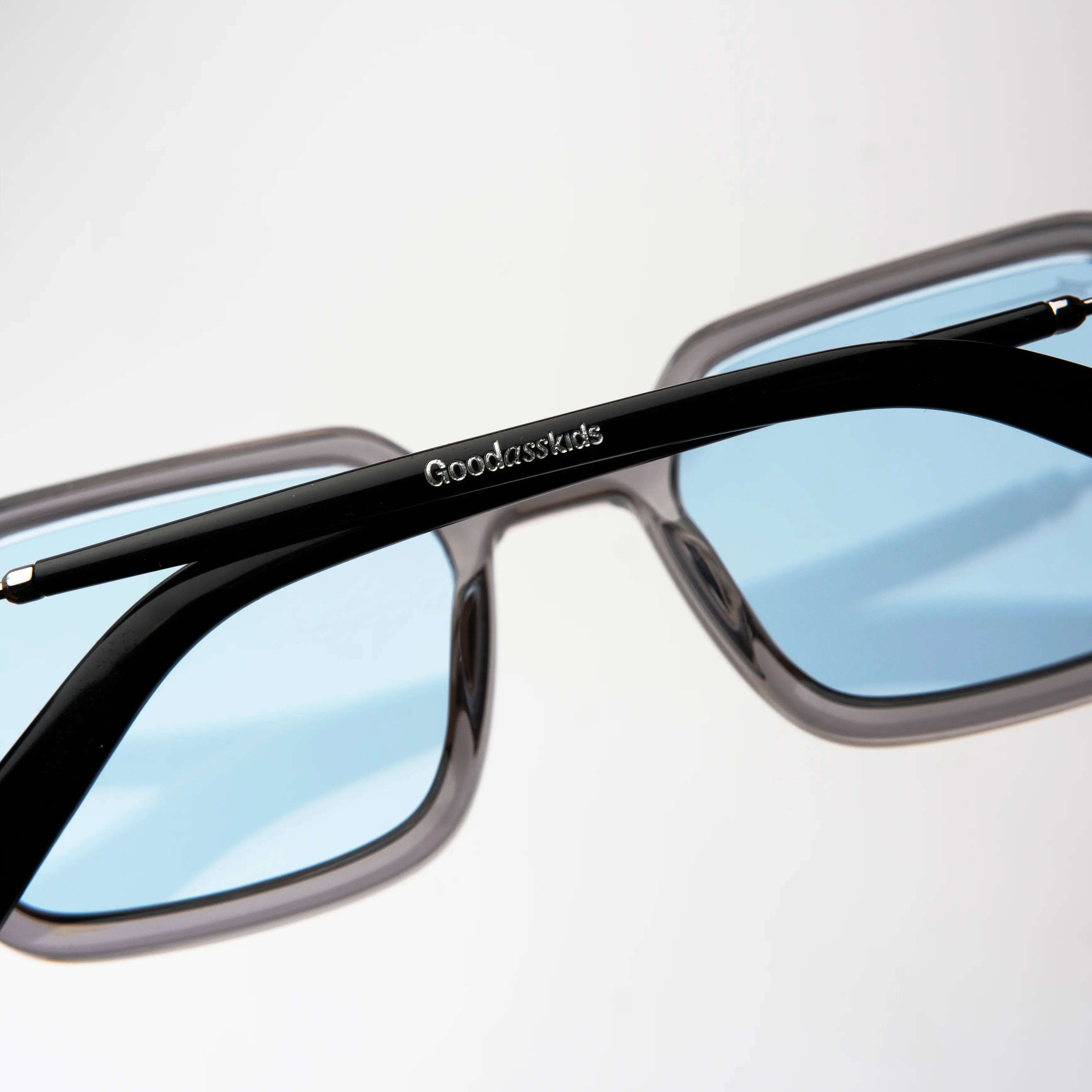 Bold Silver Sunglasses with a premium acetate frame and blue lenses, perfect for making a bold statement.