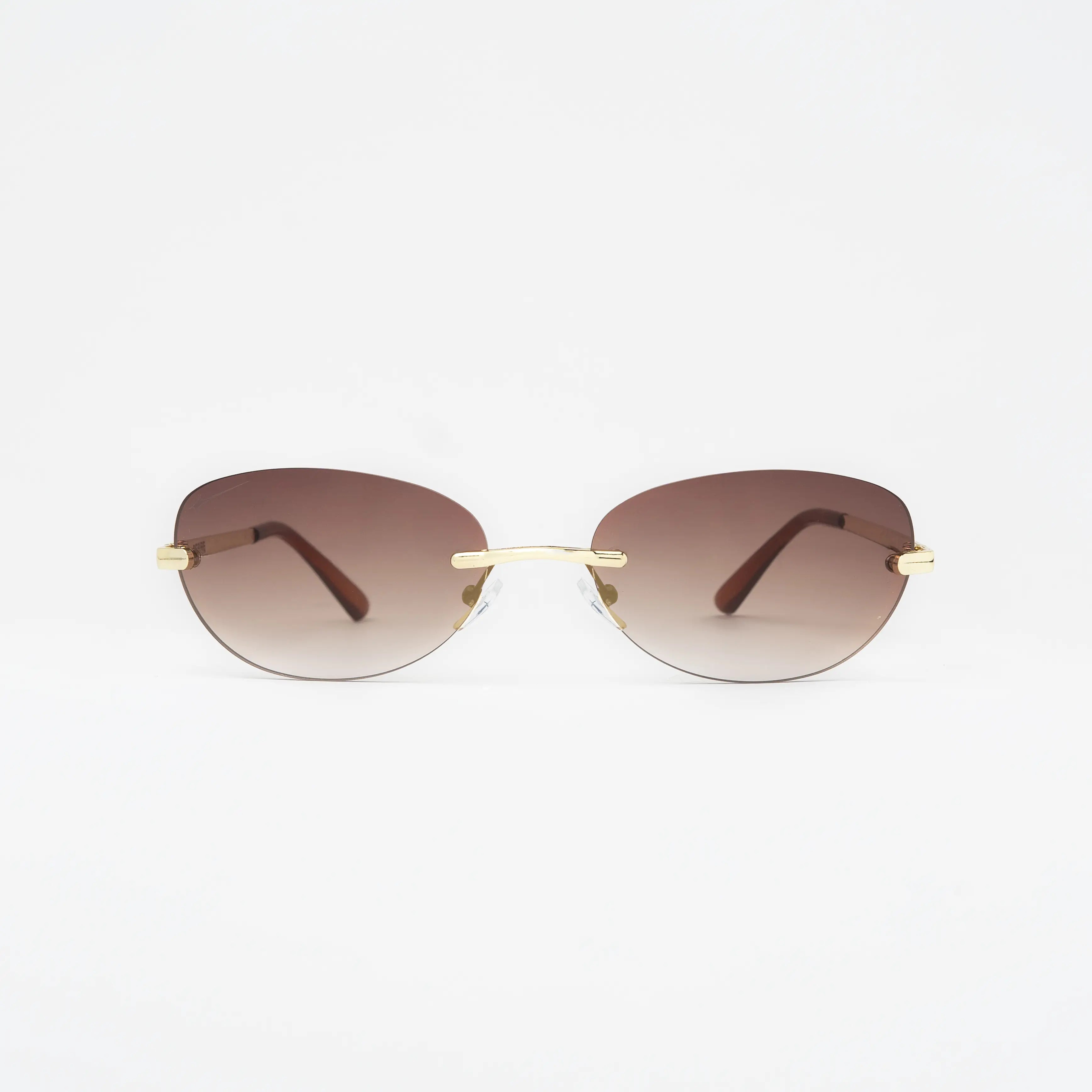 Desire Sugar Brown Sunglasses featuring brown lenses and a gold frame for a refined urban look.