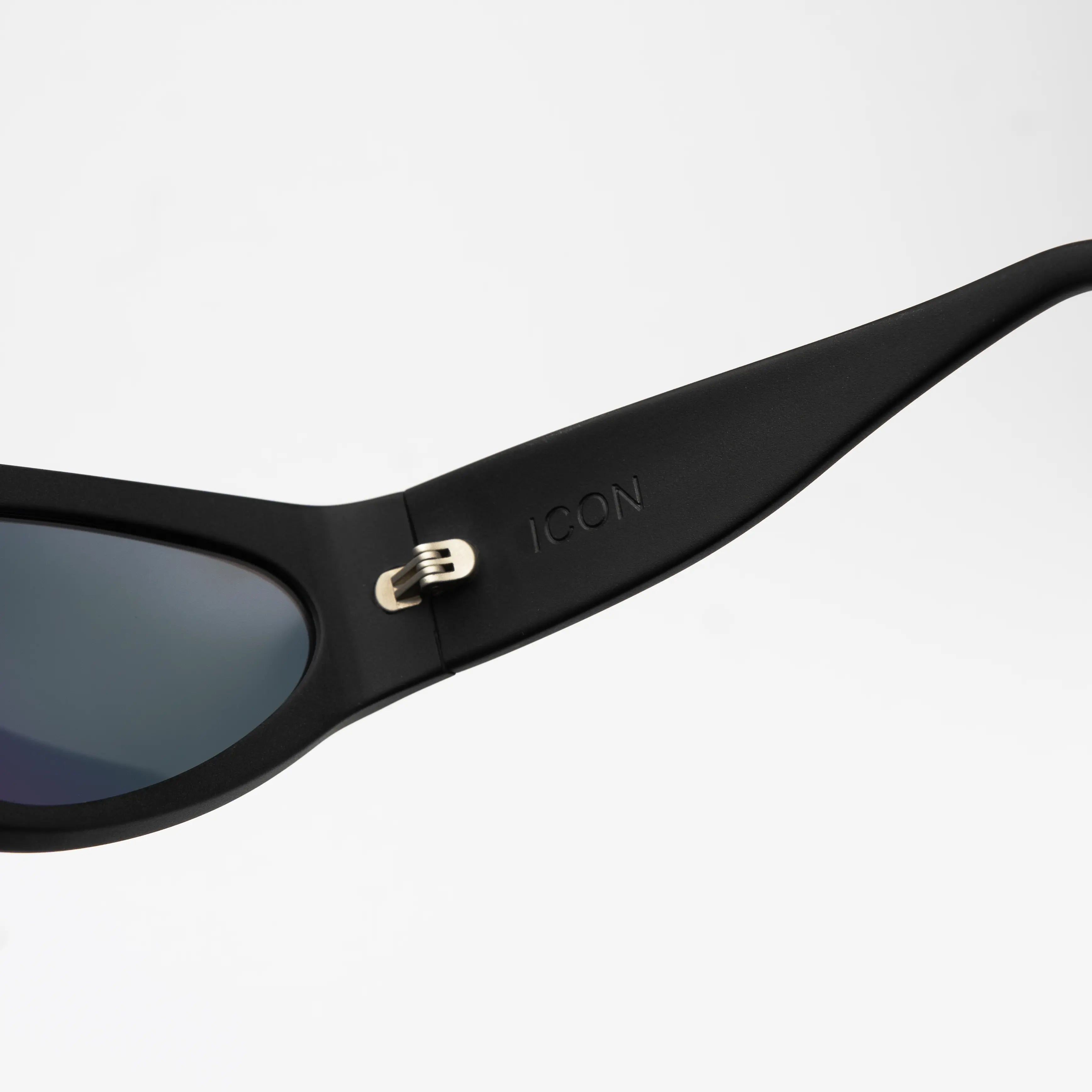 Icon Black Sunglasses at a three-quarter angle highlighting the aerodynamic shape and blackout finish.
