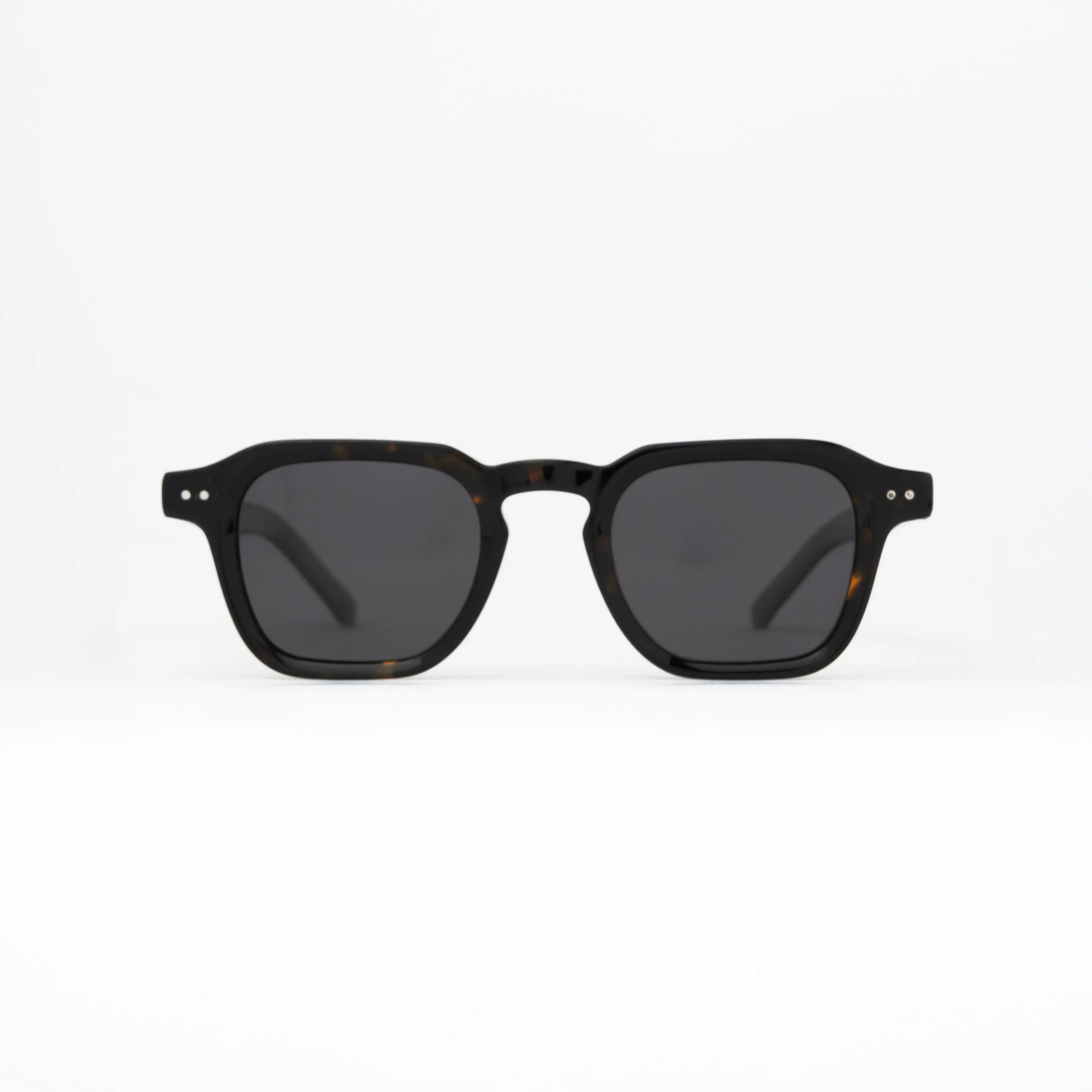 Outlaw Carey Sunglasses featuring a tortoiseshell frame and smoke polarized lenses for a clean urban look.
